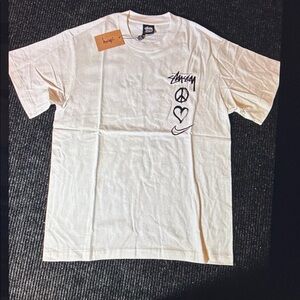 Stussy Cream Tee with Iconic Symbols